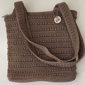 Le Sac Khaki crocheted zippered shoulder bag.